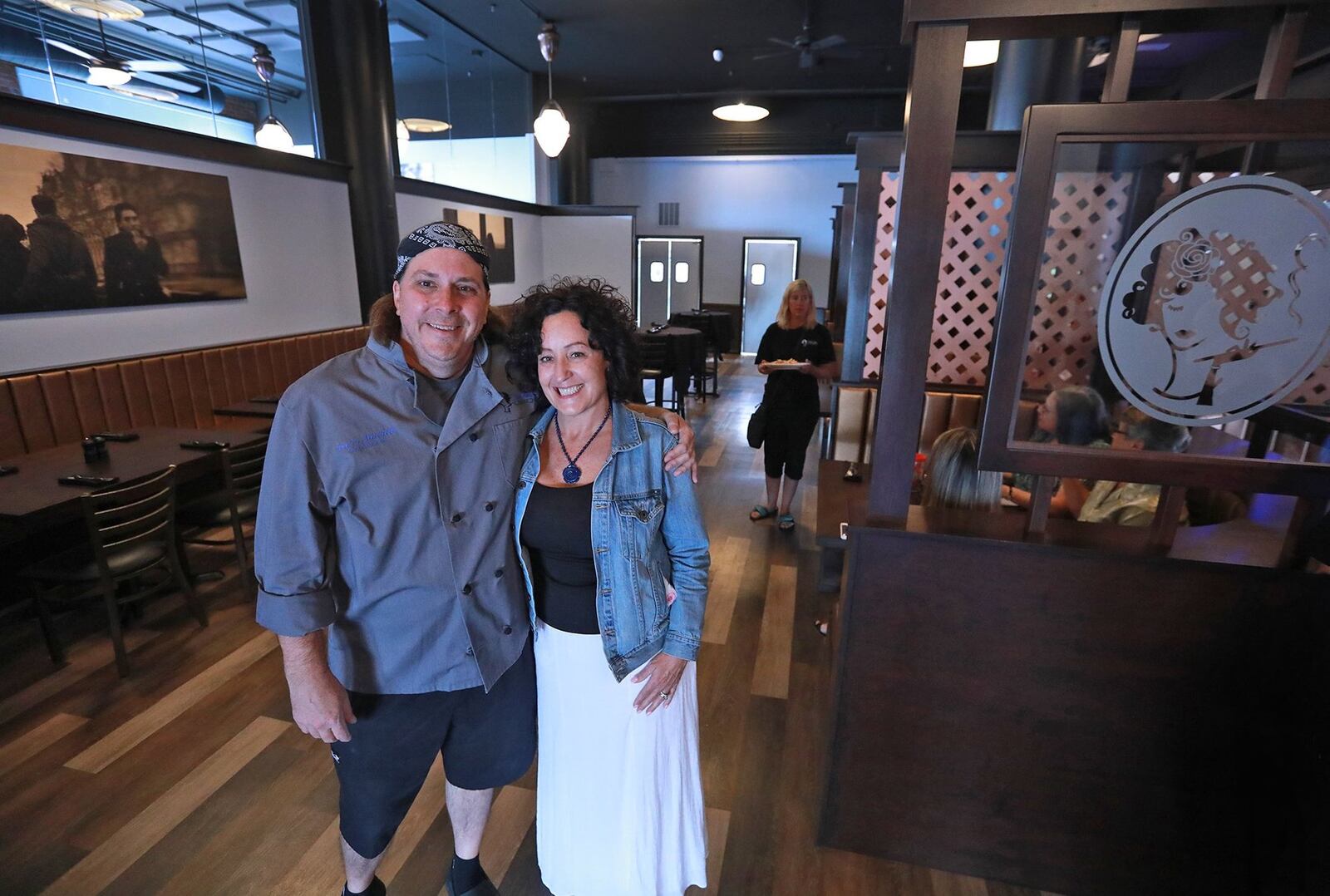 Stella Bleu Bistro co-owners, Chef Darin Mitchell and Jennie Osterholt during the grand opening of the new restaurant in downtown Springfield. BILL LACKEY/STAFF