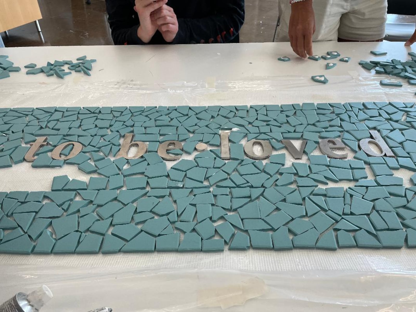 The 8/4 Memorial mosaic features poetry by Dayton poet Sierra Leone. PHOTO BY RUSSELL FLORENCE JR.