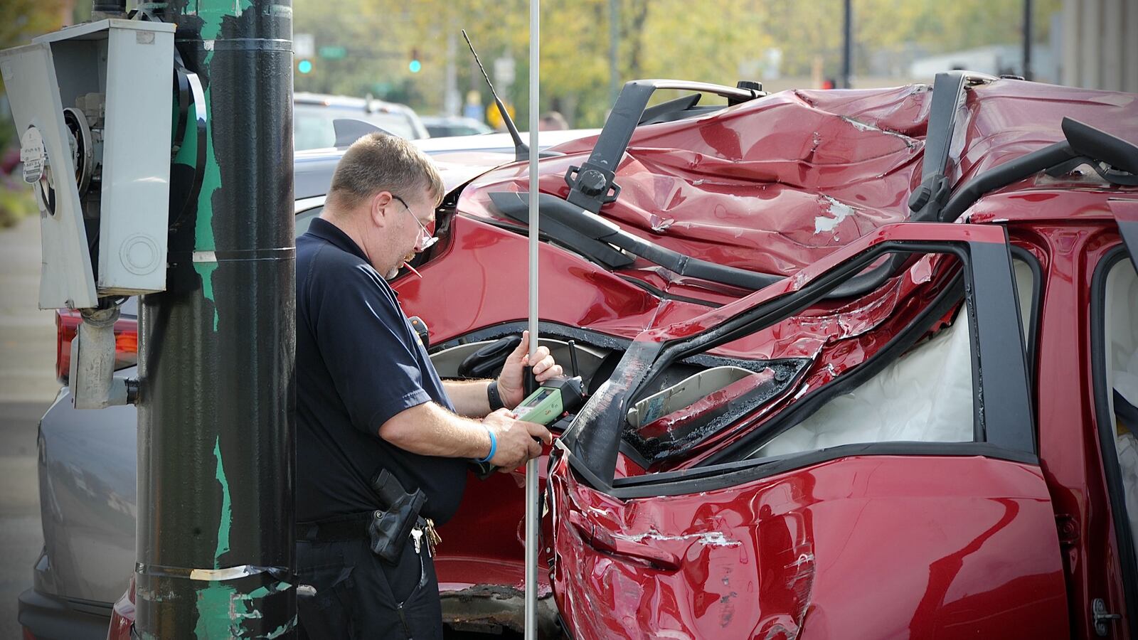 Officials investigate a crash Wednesday afternoon in which one person was killed and multiple people were injured. Two SUVs were involved in the Springfield incident.