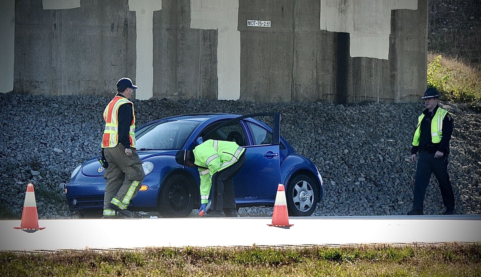 Miami Twp. police and Ohio State Highway Patrol troopers were seen inspecting a blue car after a pedestrian was struck and killed Monday morning, Nov. 8, 2021, on northbound Interstate 75 in Miami Twp. MARSHALL GORBY/STAFF