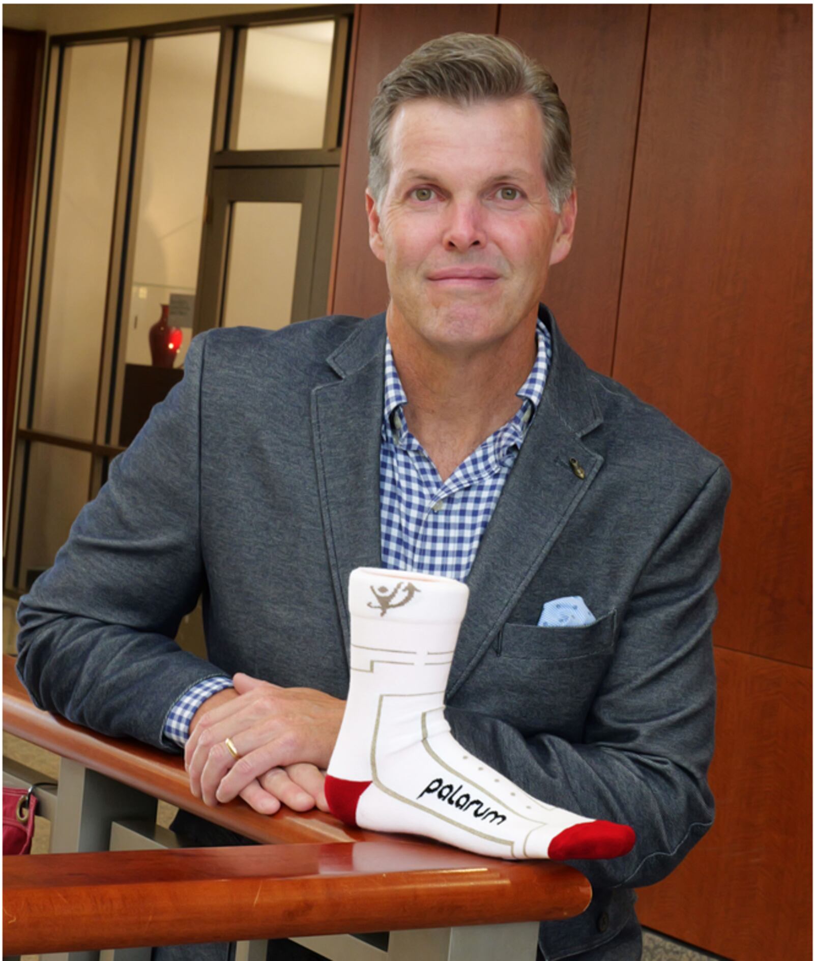 Patrick Baker, co-founder and CEO of Palarum LLC, shows one of its PUP SmartSocks which is woven with a conductible yarn that streams data and can summon nurses to help a patient who falls in their hospital room. CONTRIBUTED/PALARUM LLC