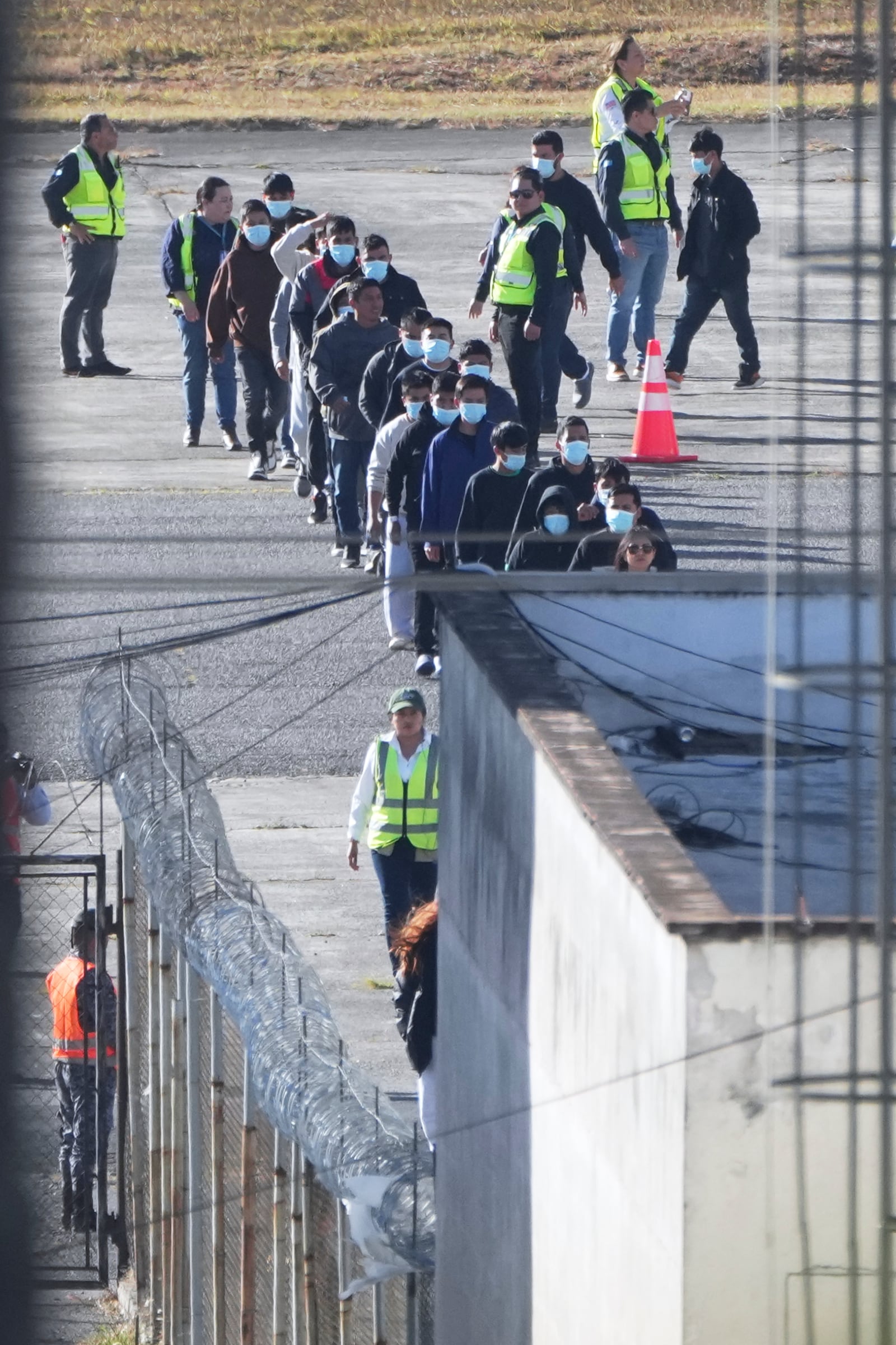 Guatemalan migrants deported from the United States disembark a U.S. military plane at La Aurora Airport in Guatemala City, Monday, Jan. 27, 2025. (AP Photo/Moises Castillo)