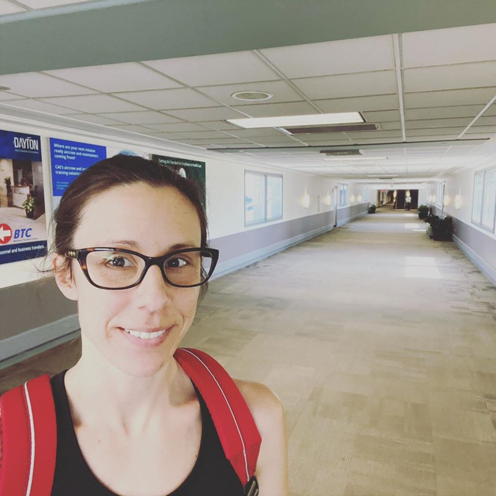 Clayton registered nurse Staci Hedke began a three week stint to help fight the coronavirus in New York. Hedke is pictured at the Dayton airport before leaving for New York.