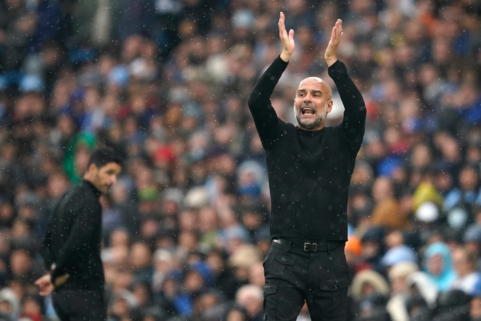 Manchester City's head coach Pep Guardiola shouts out from the touchline during the English Premier League soccer match between Manchester City and Arsenal at the Etihad stadium in Manchester, England, Sunday, Sept. 22, 2024. (AP Photo/Dave Thompson)