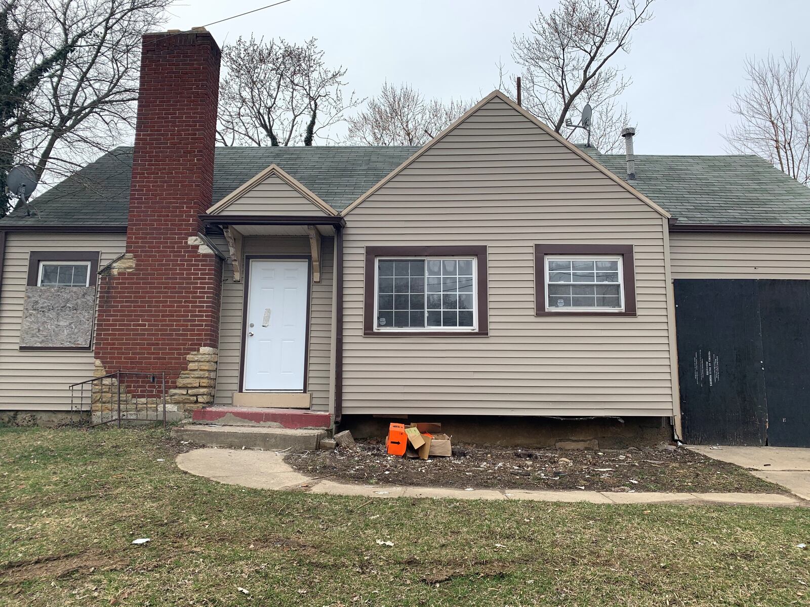 A sign over the garage of a home on Wheatley Avenue says presence is prohibited. The owner of the home received $11,500 last year through a rental assistance program funded with federal CARES Act money. The property did not have water last year.