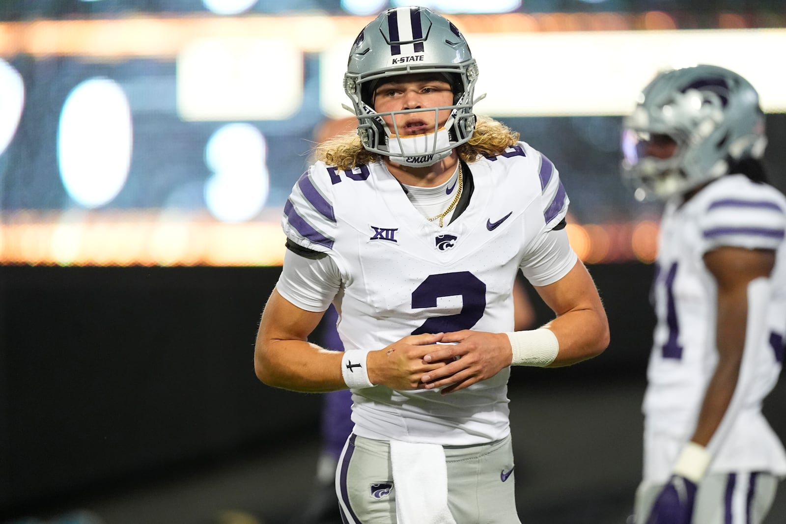 Kansas State quarterback Avery Johnson warms up before an NCAA college football game against Colorado, Saturday, Oct. 12, 2024, in Boulder, Colo. (AP Photo/David Zalubowski)