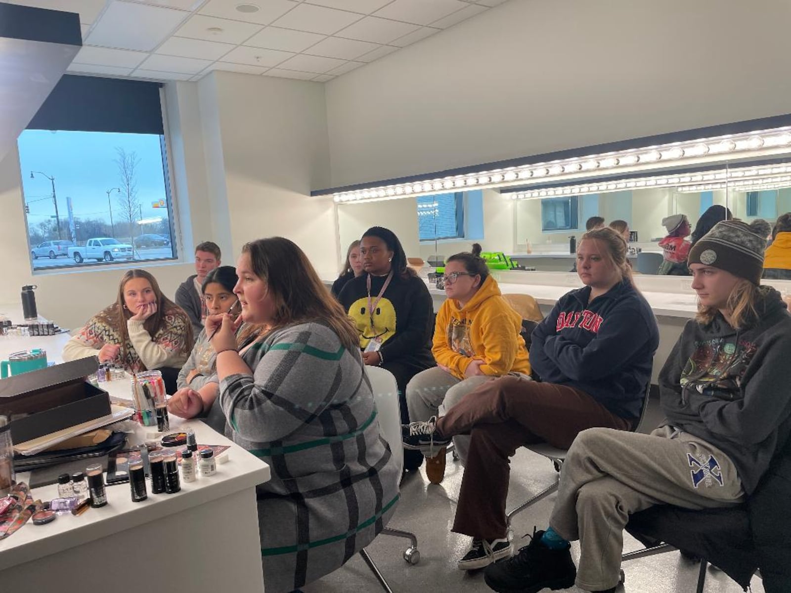 Students examine the art of stage makeup inside the University of Dayton's Roger Glass Center for the Arts. PHOTO BY RUSSELL FLORENCE JR.