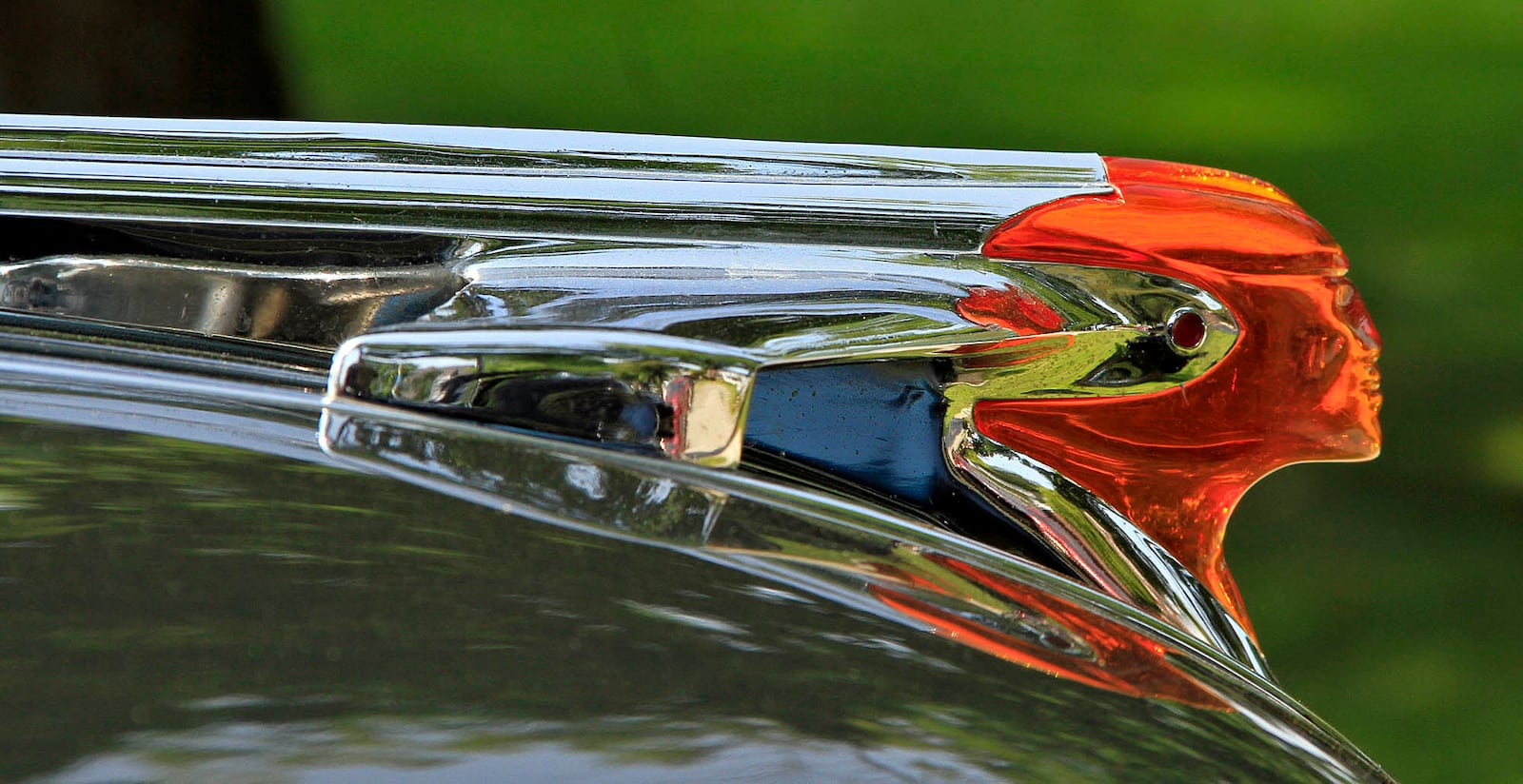 The hood ornament on a 1953 Pontiac at a Classics on the Lawn car show in Oakwood. © Photograph by Skip Peterson