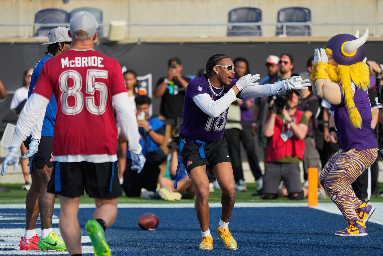 NFC wide receiver Justin Jefferson (18), of the Minnesota Vikings, celebrates after scoring a touchdown during the flag football event at the NFL Pro Bowl, Sunday, Feb. 2, 2025, in Orlando. (AP Photo/John Raoux)