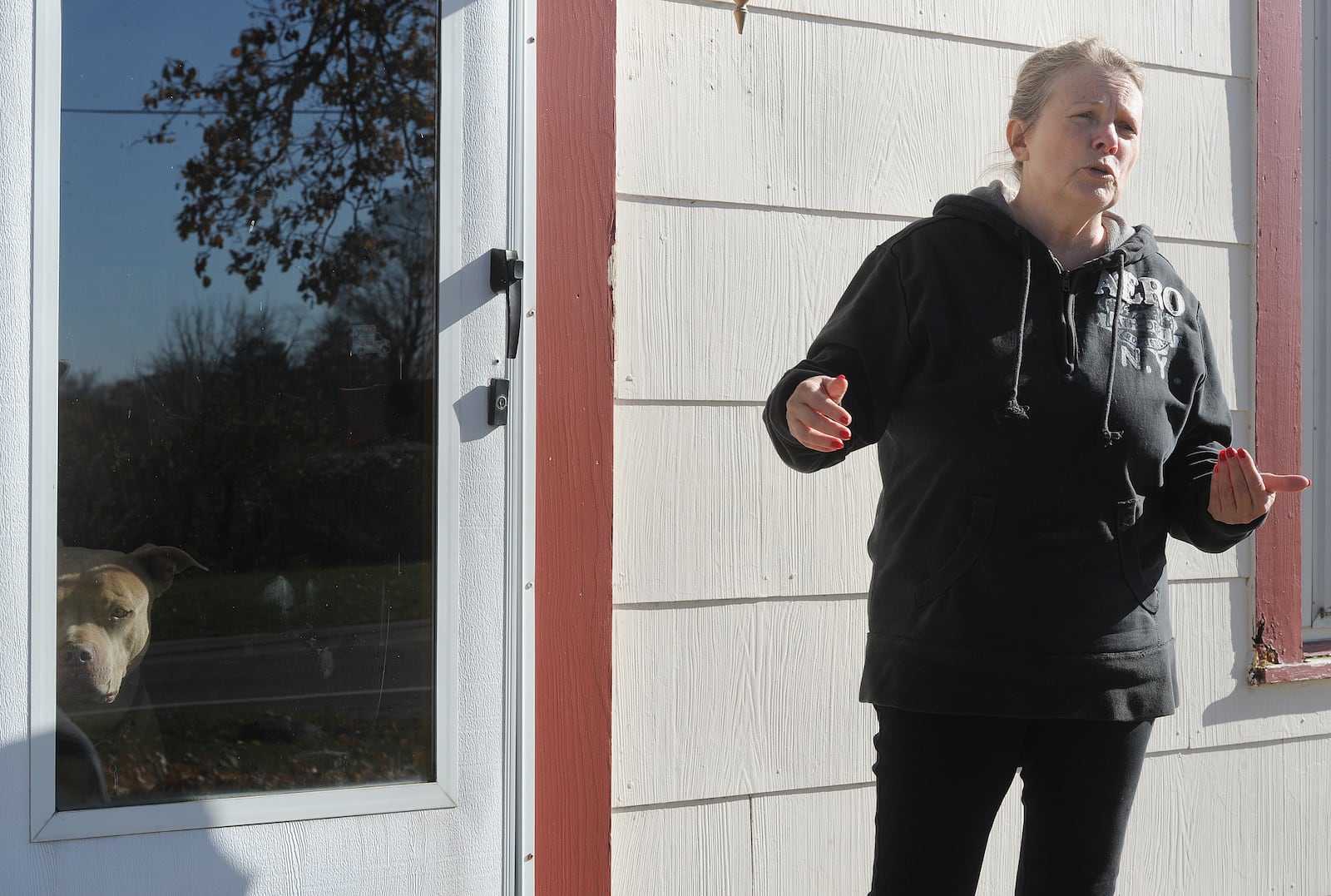 Sherry Edwards stand in front of her home in Butler Twp., Montgomery County, while discussing her options for testing her well for PFAS after the potentially deadly chemicals were discovered at nearby Aullwood Audubon Farm Discovery Center.  MARSHALL GORBY\STAFF