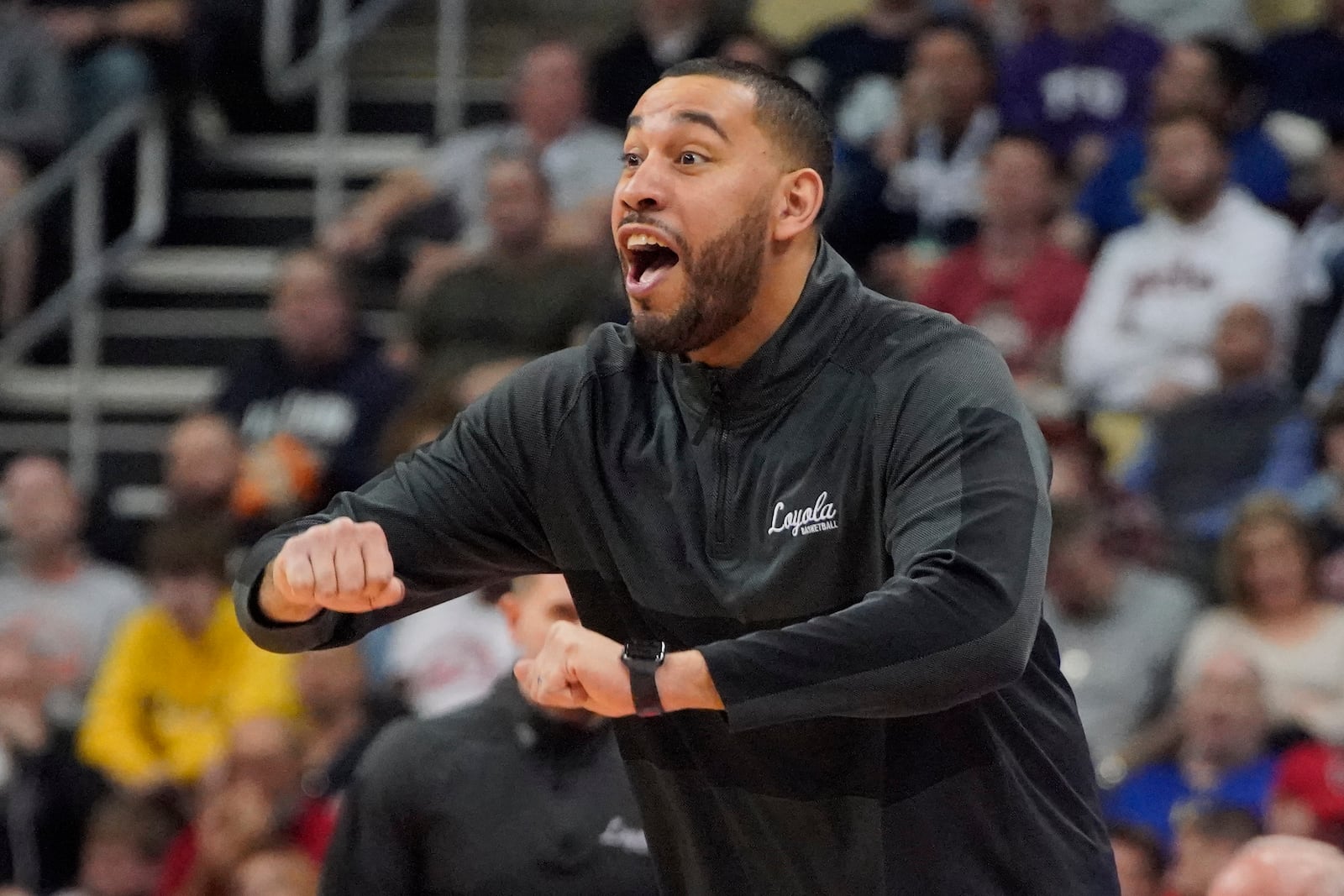 FILE - Loyola of Chicago head coach Drew Valentine yells instructions during the second half of a college basketball game against Ohio State in the first round of the NCAA tournament in Pittsburgh, Friday, March 18, 2022. The 30-year-old Valentine is preparing for his second season as Loyola Chicago's coach and is one of several promising voices in college basketball's next generation of coaches. (AP Photo/Gene J. Puskar, File)