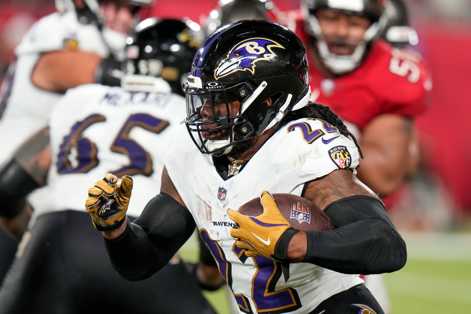 Baltimore Ravens running back Derrick Henry (22) runs the ball against the Tampa Bay Buccaneers during the second half of an NFL football game, Monday, Oct. 21, 2024, in Tampa, Fla. (AP Photo/Chris O'Meara)