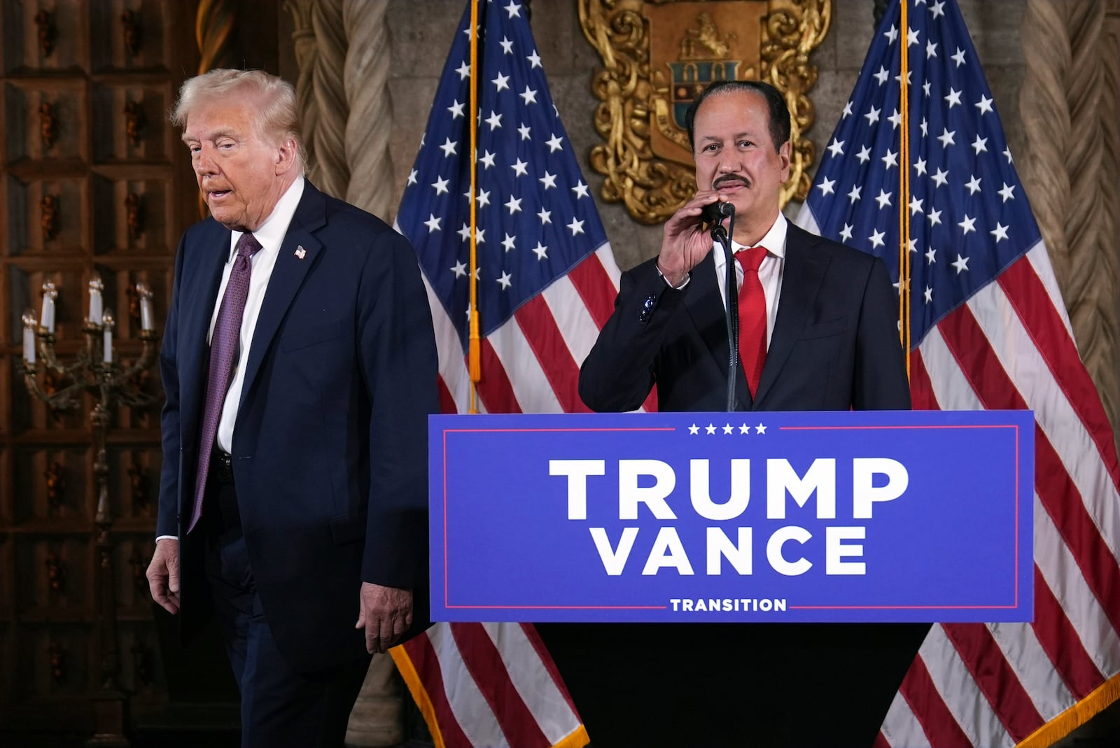 Hussain Sajwani, CEO of DAMAC Properties, speaks as President-elect Donald Trump listens during a news conference at Mar-a-Lago, Tuesday, Jan. 7, 2024, in Palm Beach, Fla. (AP Photo/Evan Vucci)