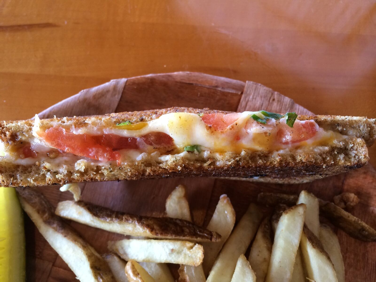 Christopher’s Hot Cheese Supreme ($5.50): Delicious, melty provolone, cheddar and Swiss cheese, topped with tomato, mayo and scallions. We added fries for an extra $1.75. (MICHELLE FONG/STAFF)