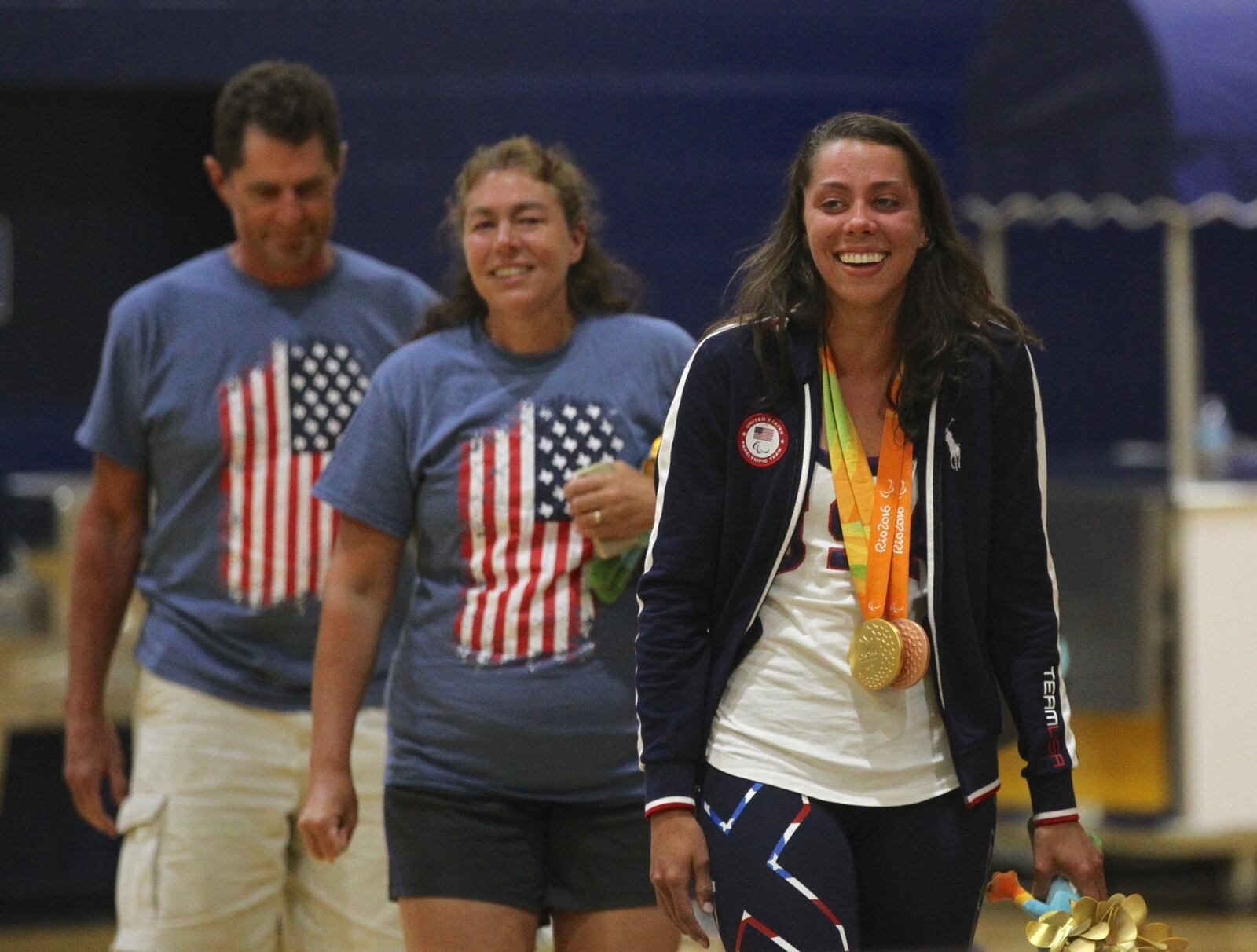 Grace Norman, right and her parents, Robin and Tim, arrive at a ceremony honoring her at Cedarville University on Wednesday, Sept. 14, 2016. David Jablonski/Staff