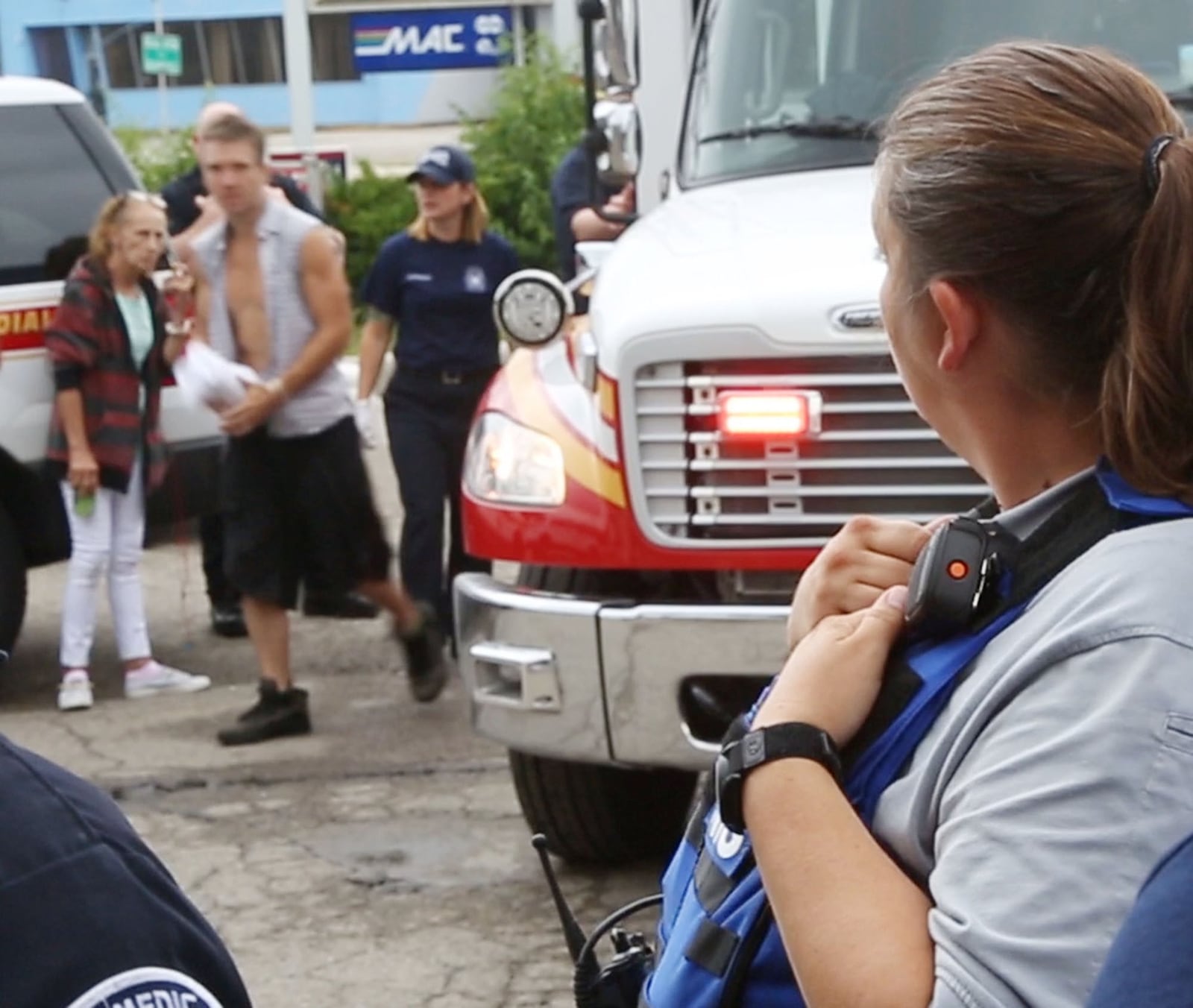 Dayton Fire Department Addiction Resource Liaison/EMT Amy Dunkin, right, watches a man she just revived with Narcan walk out of the Dayton medic unit on North Keowee Street. TY GREENLEES / STAFF