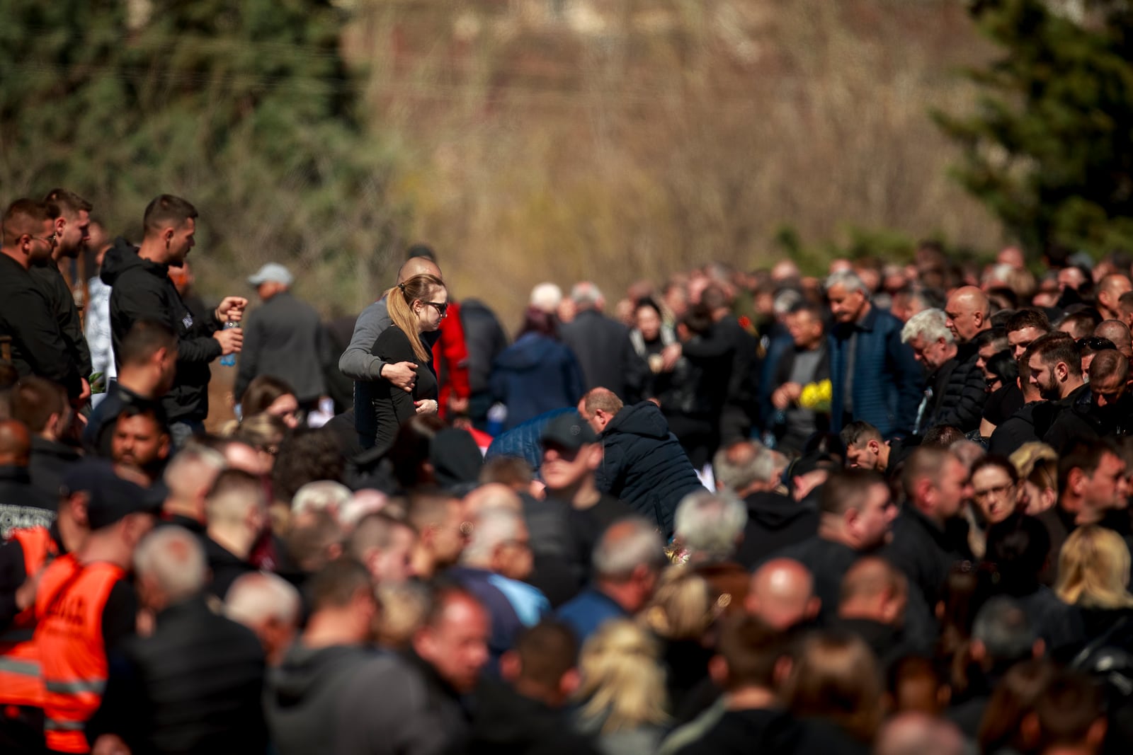 People attend the funeral ceremony of the victims of a massive nightclub fire in the town of Kocani, North Macedonia, Thursday, March 20, 2025. (AP Photo/Visar Kryeziu)