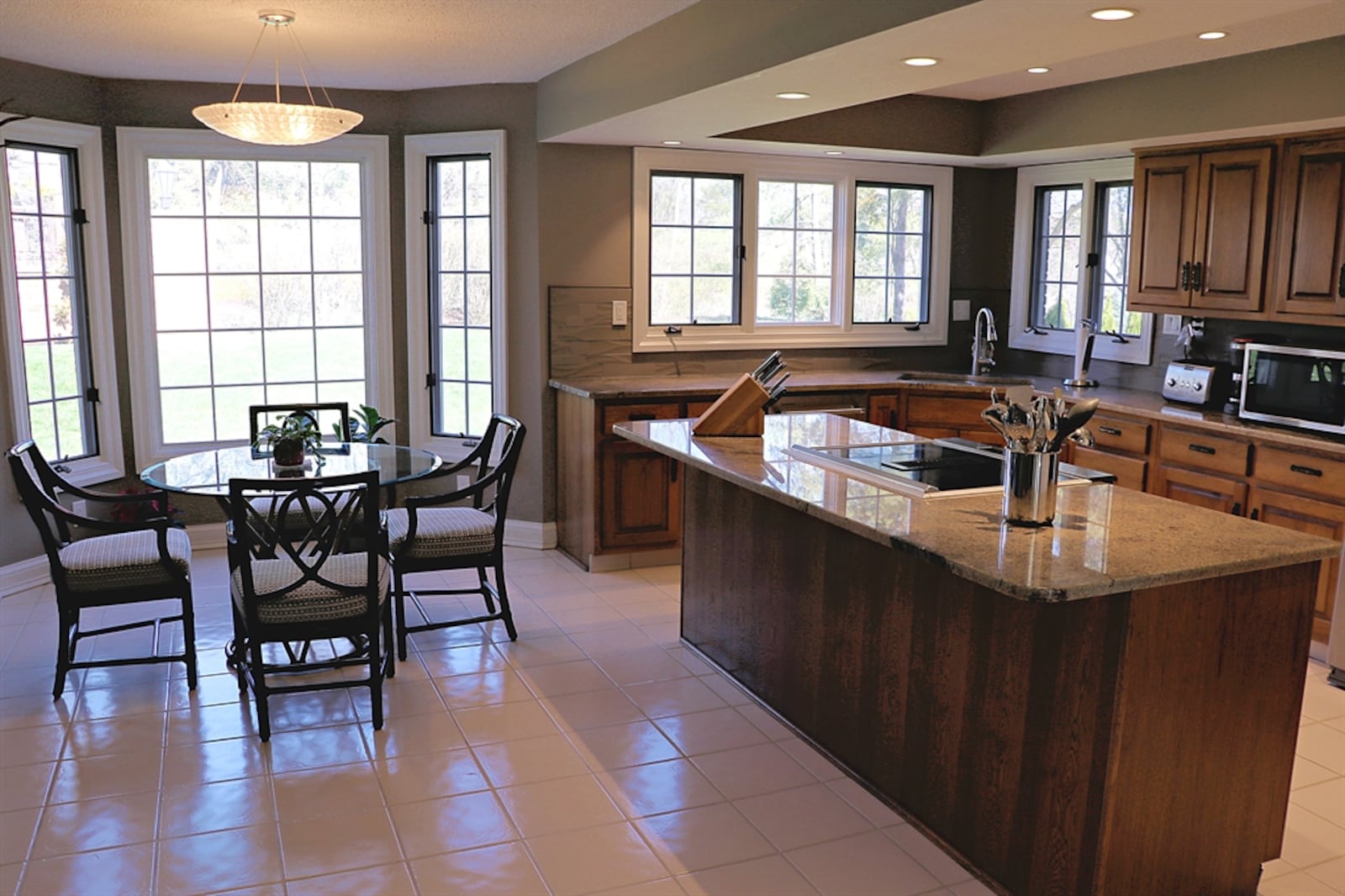 The kitchen is equipped with updated appliances, and ceramic-tile flooring fills the kitchen and breakfast room.