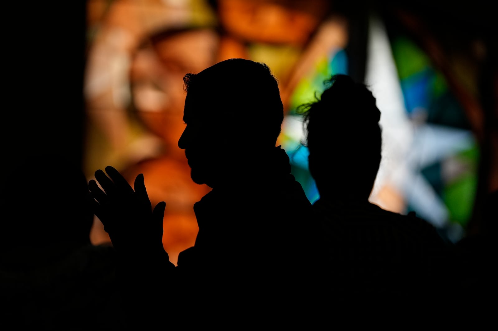 People pray during a Mass celebrating the feast day of Guatemala's Black Christ of Esquipulas at St. Mary's Catholic Church in Worthington, Minnesota, Sunday, Jan. 12, 2025. (AP Photo/Abbie Parr)