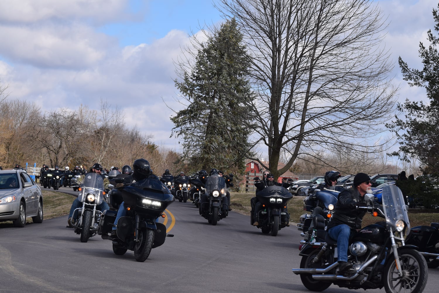 PHOTOS: Thousands of Outlaws attend motorcycle gang leaders funeral at Montgomery County Fairgrounds.