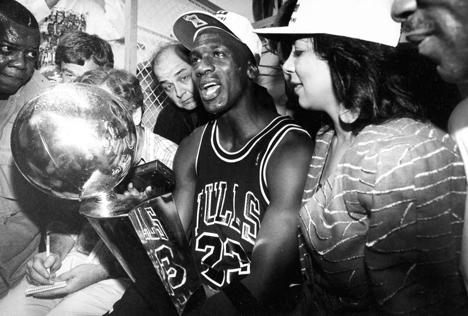 FILE - Chicago Bulls' Michael Jordan holds the trophy after the Bulls' 108-101 win over the Los Angeles Lakers in game five for the NBA championship in Inglewood, Calif., June 12, 1991. (AP Photo/Reed Saxon, File)