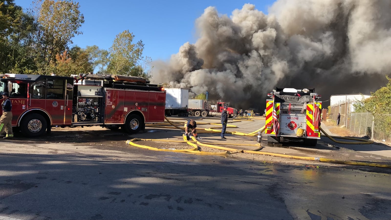 Fire crews attempt to extinguish a blaze at the Cohen Recycling facility in the 5100 block of Farmersville-West Carrollton Road, just across the Great Miami River from downtown West Carrollton. LYNN HULSEY / STAFF PHOTO