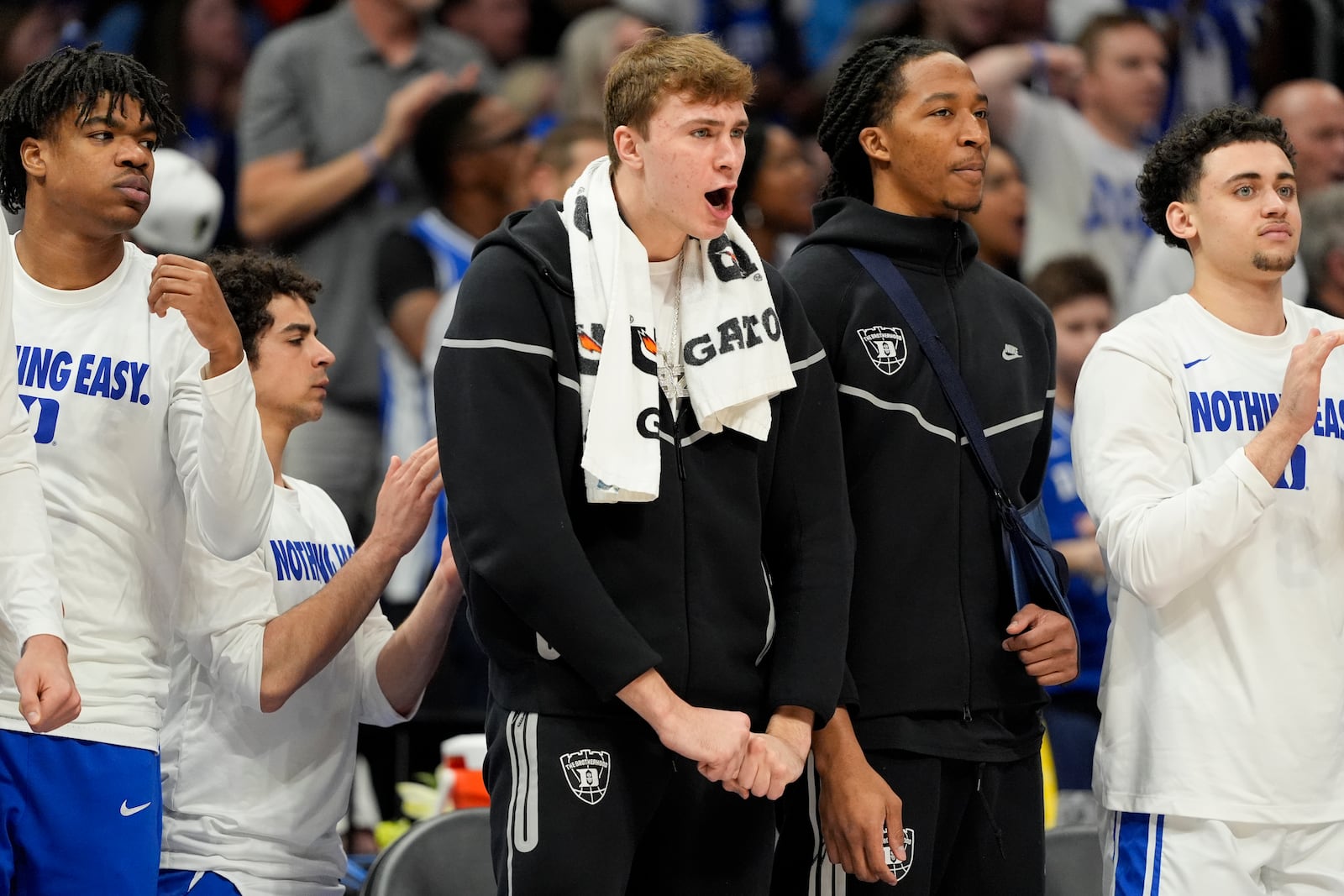 Duke forward Cooper Flagg, left, and forward Maliq Brown watch from the bench during the second half of an NCAA college basketball game against North Carolina in the semifinals of the Atlantic Coast Conference tournament, Friday, March 14, 2025, in Charlotte, N.C. Flagg and Brown were injured yesterday. (AP Photo/Chris Carlson)