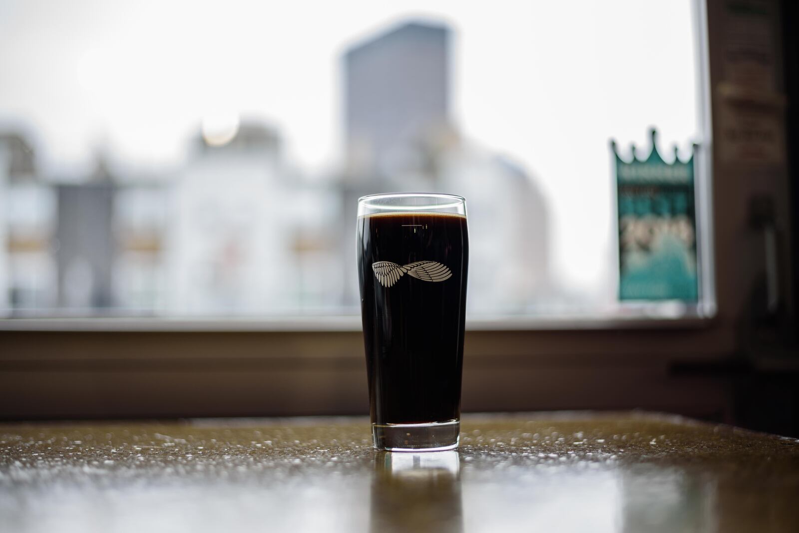 Warped Wing Brewing Company tapped the 10 TON Irish Cream Stout, a special variation of their Oatmeal Stout ahead of St. Patrick's Day at their brewery in downtown Dayton on Saturday, March 9. TOM GILLIAM / CONTRIBUTING PHOTOGRAPHER