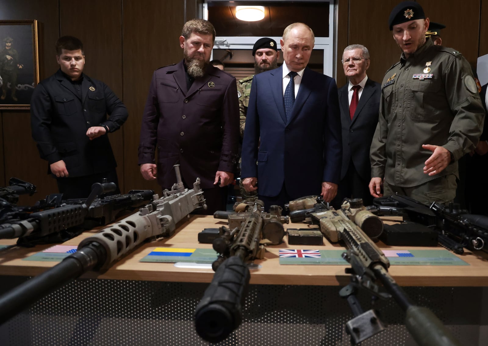 FILE - Russian President Vladimir Putin, accompanied by head of the Chechen Republic Ramzan Kadyrov inspects NATO military trophies captured in the battles in Ukraine, during his visit to the Russian Special Forces University in Gudermes, Chechen Republic, Russia, Tuesday, Aug. 20, 2024. (Vyacheslav Prokofyev, Sputnik, Kremlin Pool Photo via AP)