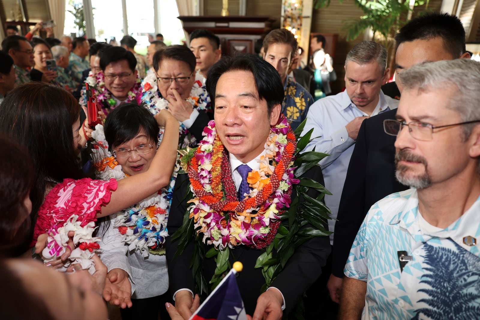 Taiwan President Lai Ching-te, center, greets people at the Kahala Hotel and Resort Saturday, Nov. 30, 2024 in Honolulu. (AP Photo/Marco Garcia)