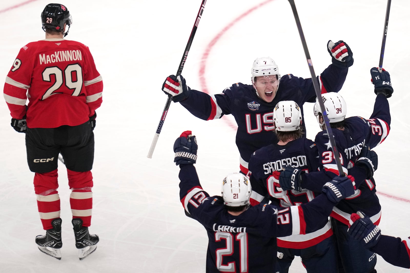 United States' Jake Sanderson (85) is congratulated after his goal against Canada during the second period of the 4 Nations Face-Off championship hockey game, Thursday, Feb. 20, 2025, in Boston. (AP Photo/Charles Krupa)