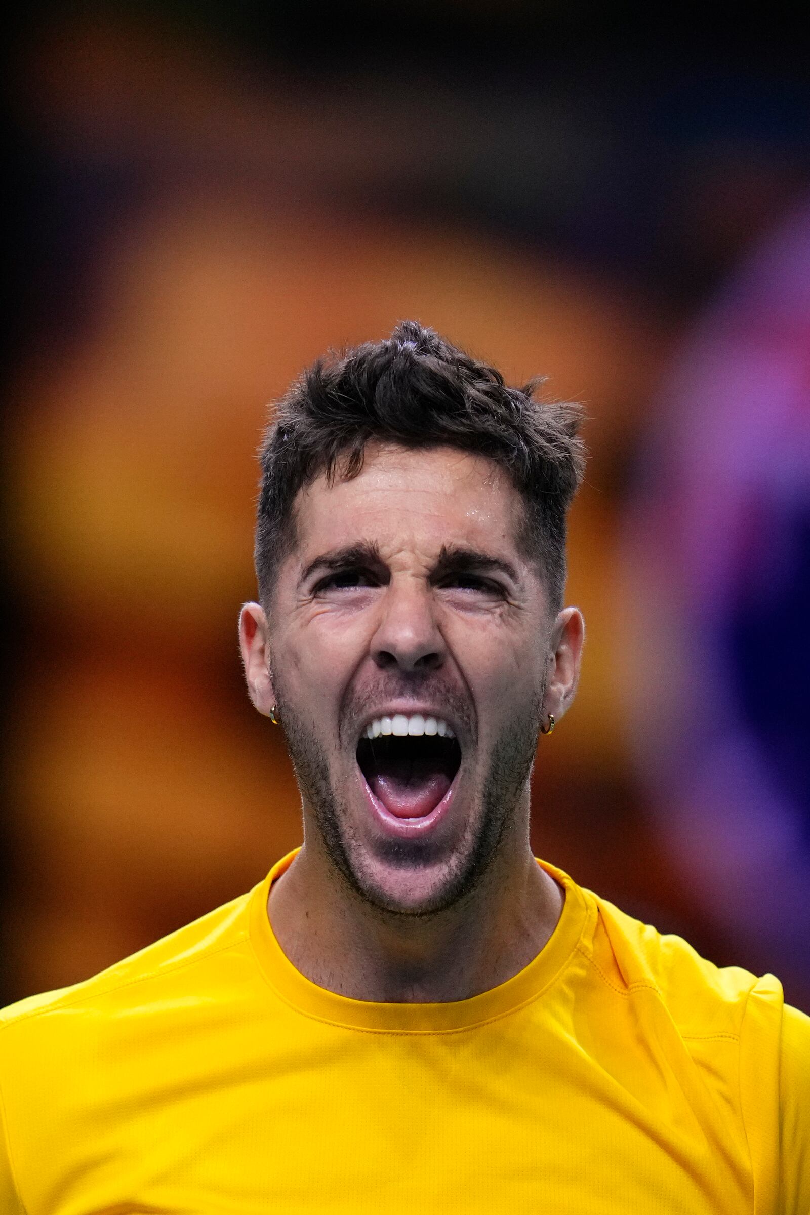 Australia's Athanasios Kokkinakis celebrates after winning against Ben Shelton of the United States during a Davis Cup quarterfinal match at the Martin Carpena Sports Hall, in Malaga, southern Spain, on Thursday, Nov. 21, 2024. (AP Photo/Manu Fernandez)