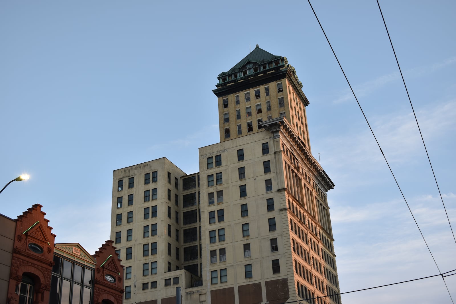 One of the partners on the Dayton Arcade rehab project plan to redevelop the Centre City building, located across the street, into a mix of new uses. CORNELIUS FROLIK / STAFF