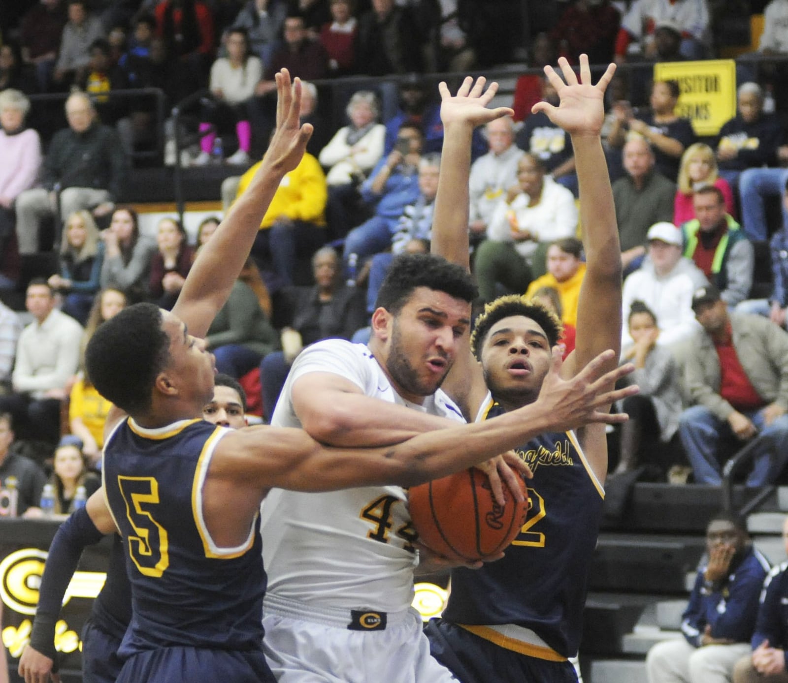 Centerville’s Jevon Henderson (with ball) beats Springfield’s RaHeim Moss (5) and Jordan Howard (2) for a rebound. Centerville defeated visiting Springfield 50-48 in a boys high school basketball game on Friday, Feb. 2, 2018. MARC PENDLETON / STAFF