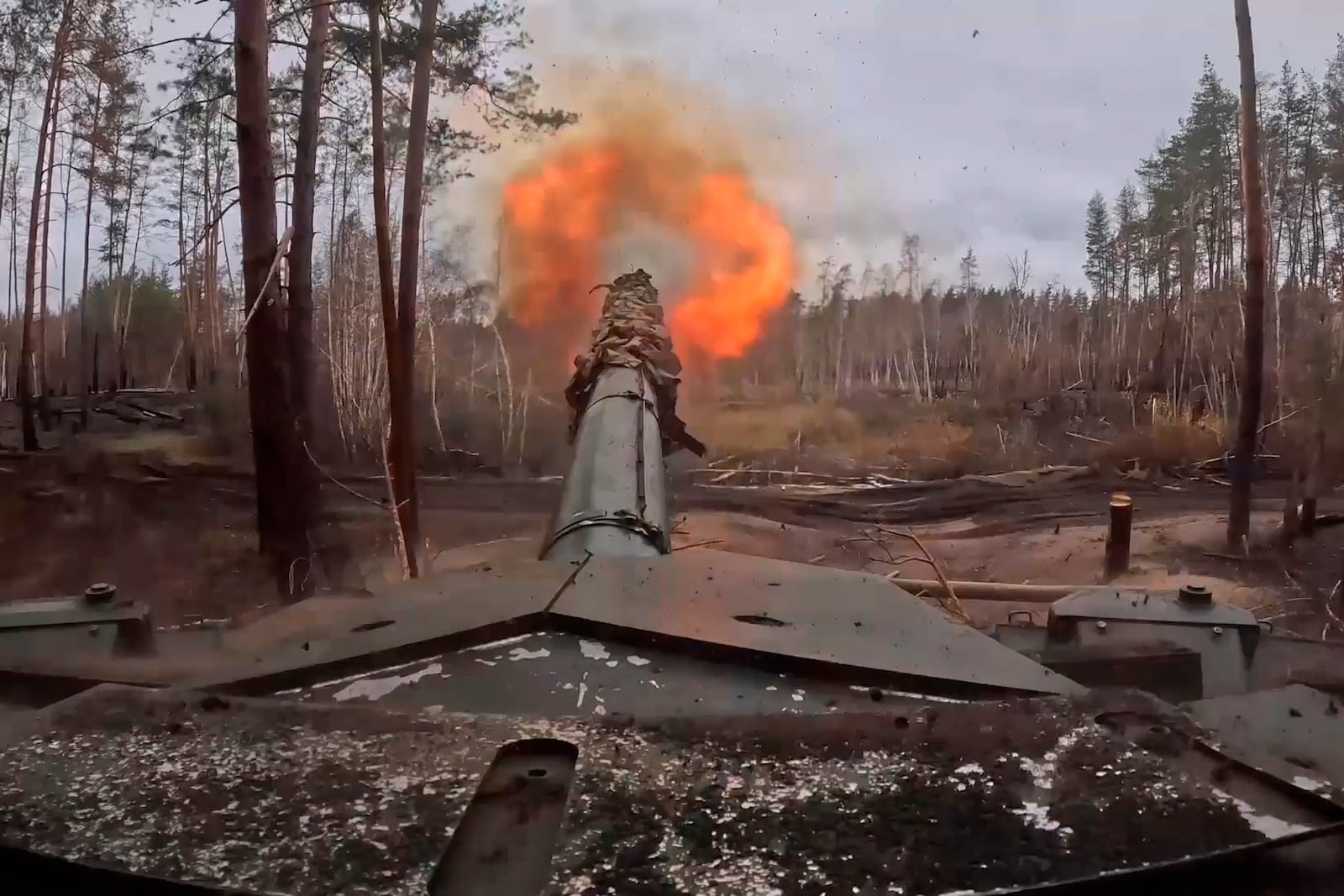 In this photo taken from a video released by Russian Defense Ministry press service no Friday, Nov. 22, 2024, Russian T90M Proryv tank fires towards Ukrainian positions at an undisclosed location in Ukraine. (Russian Defense Ministry Press Service via AP)