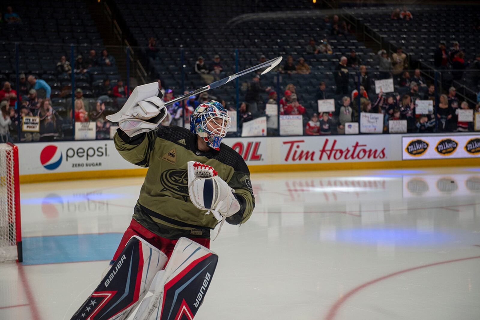 Columbus Blue Jackets goaltender Elvis Merzļikins warms up in a camouflage-style uniform as part of Military Appreciation Night on April 7 at Nationwide Arena. U.S. AIR FORCE PHOTO/SENIOR AIRMAN JACK GARDNER