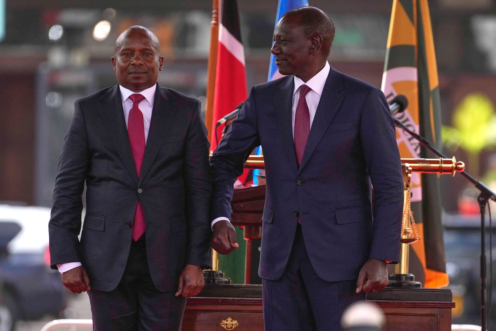 Kenya's President William Ruto, right, elbow bumps Kenya's new Deputy President Kithure Kindiki, during his swearing in ceremony, at Kenyatta International Convention Centre, in Nairobi, Kenya Friday, Nov. 1, 2024. (AP Photo/Brian Inganga)