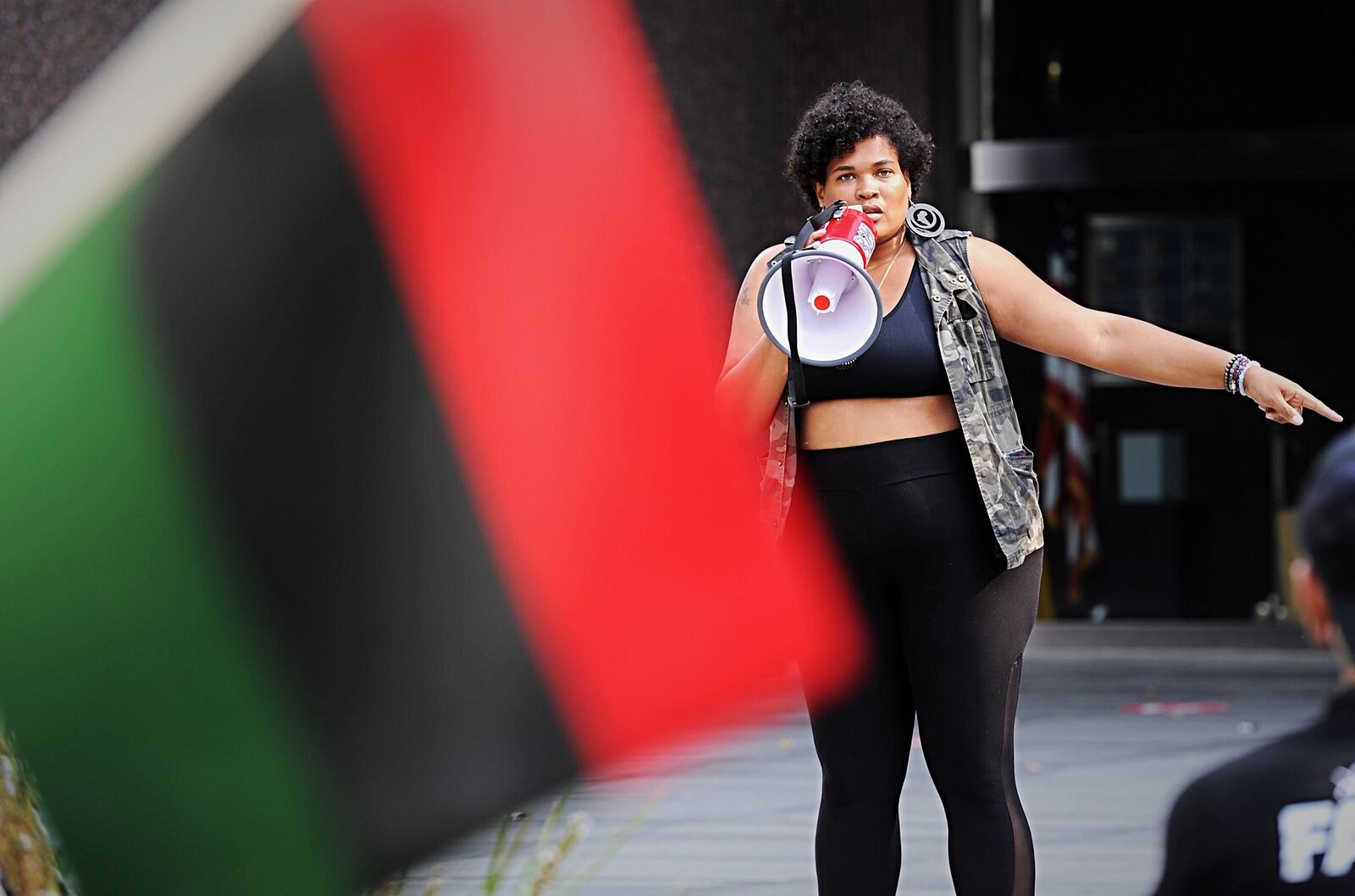 Asia Dukes speaks at a rally in front of the federal building on Saturday. 