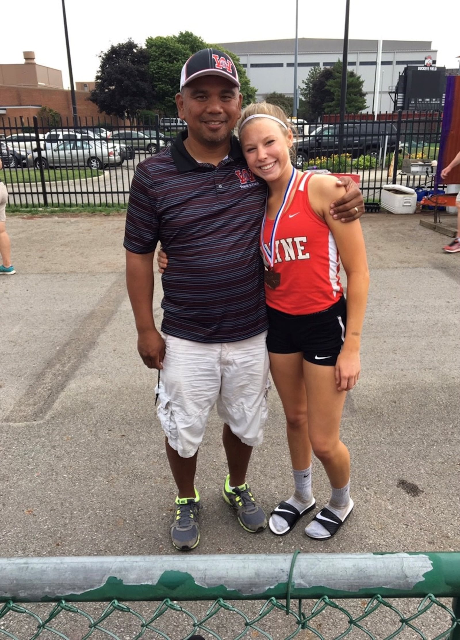 Taylor Robertson with Hall of Fame Wayne High Coach Michael Fernandez, whom she said is  “like a second dad to me.” He took her under his wing when she was diagnosed with lupus and found herself dealing with rheumatoid arthritis, as well. She became a state champion for Wayne and Fernandez, who had 241 state qualifiers at Wayne during his 23 years as head coach calls her “one of the top five kids I’ve ever coached.” (Contributed Photo)