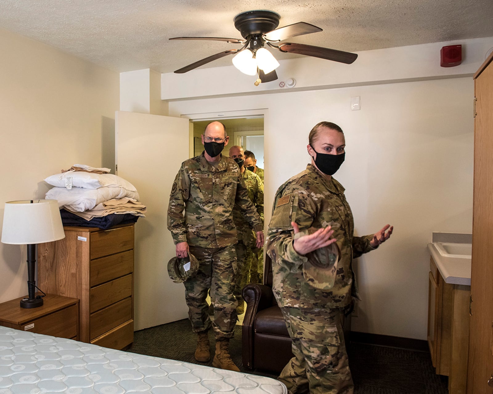 Gen. Duke Richardson, Air Force Materiel Command commander, walks through a dorm room during an Aug. 22 tour led by Tech. Sgt. Courtnie Johnson at Wright-Patterson Air Force Base. U.S. AIR FORCE PHOTO/JAIMA FOGG