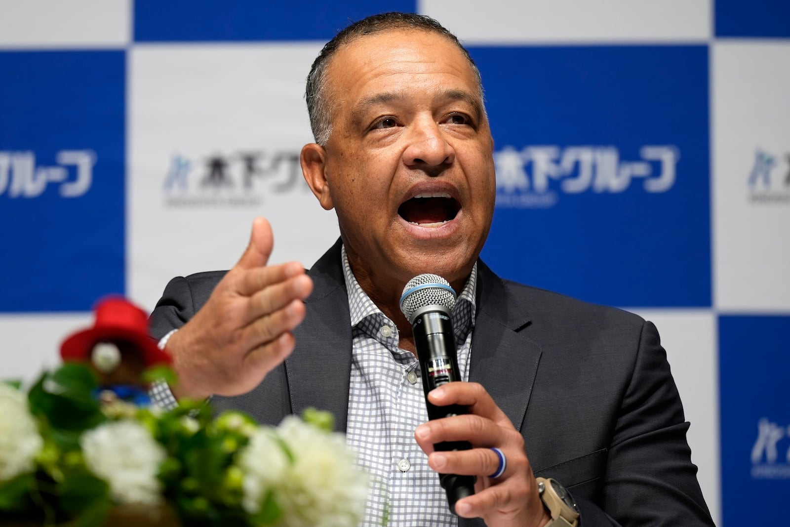 Los Angeles Dodgers manager Dave Roberts attends a press conference on the commercials he appears Wednesday, Dec. 4, 2024, in Tokyo. (AP Photo/Eugene Hoshiko)