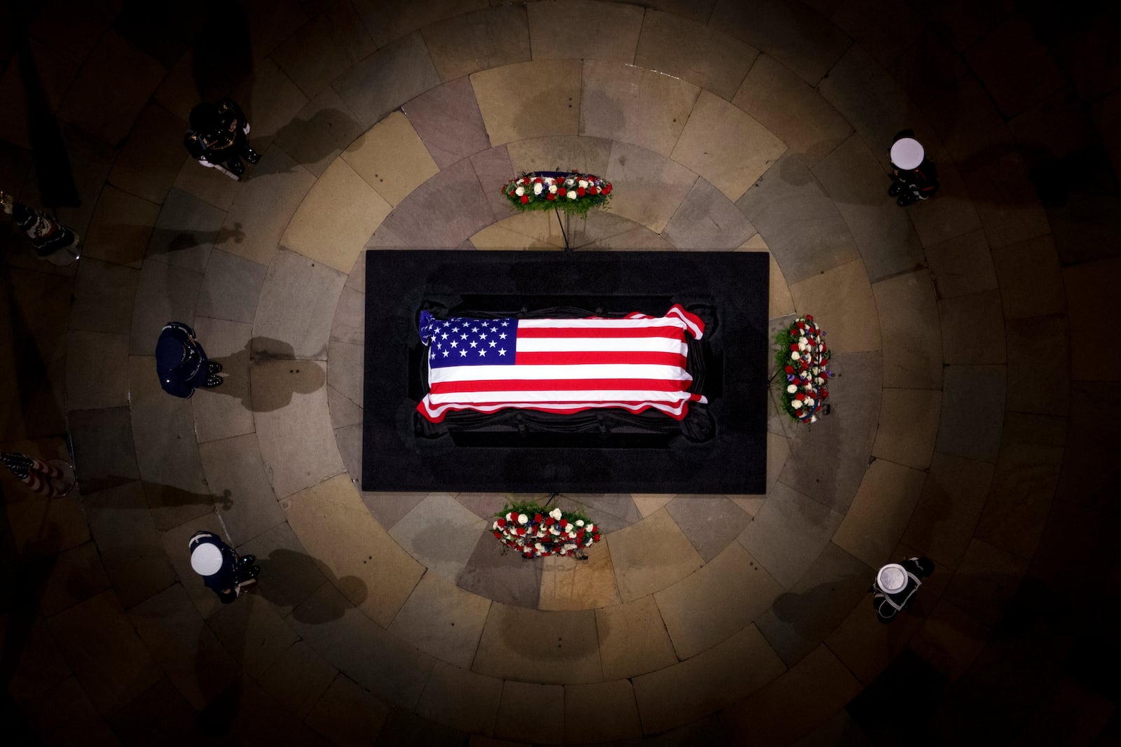 The flag-draped casket of former President Jimmy Carter lies in state at the rotunda of the U.S. Capitol Tuesday, Jan. 7, 2025, in Washington. (Andrew Harnik/Pool via AP)