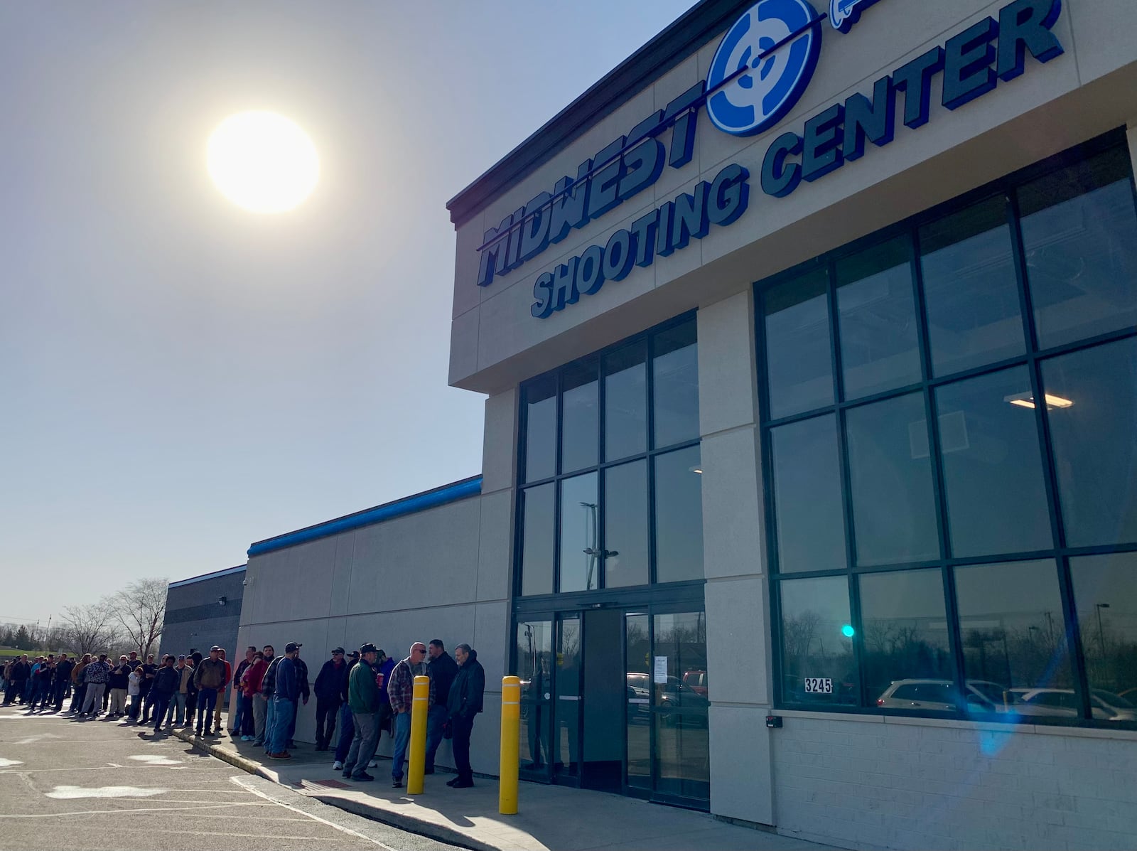 Shooting sports enthusiasts were lined up outside Midwest Shooting Center in Beavercreek for its opening Saturday morning. LONDON BISHOP/STAFF