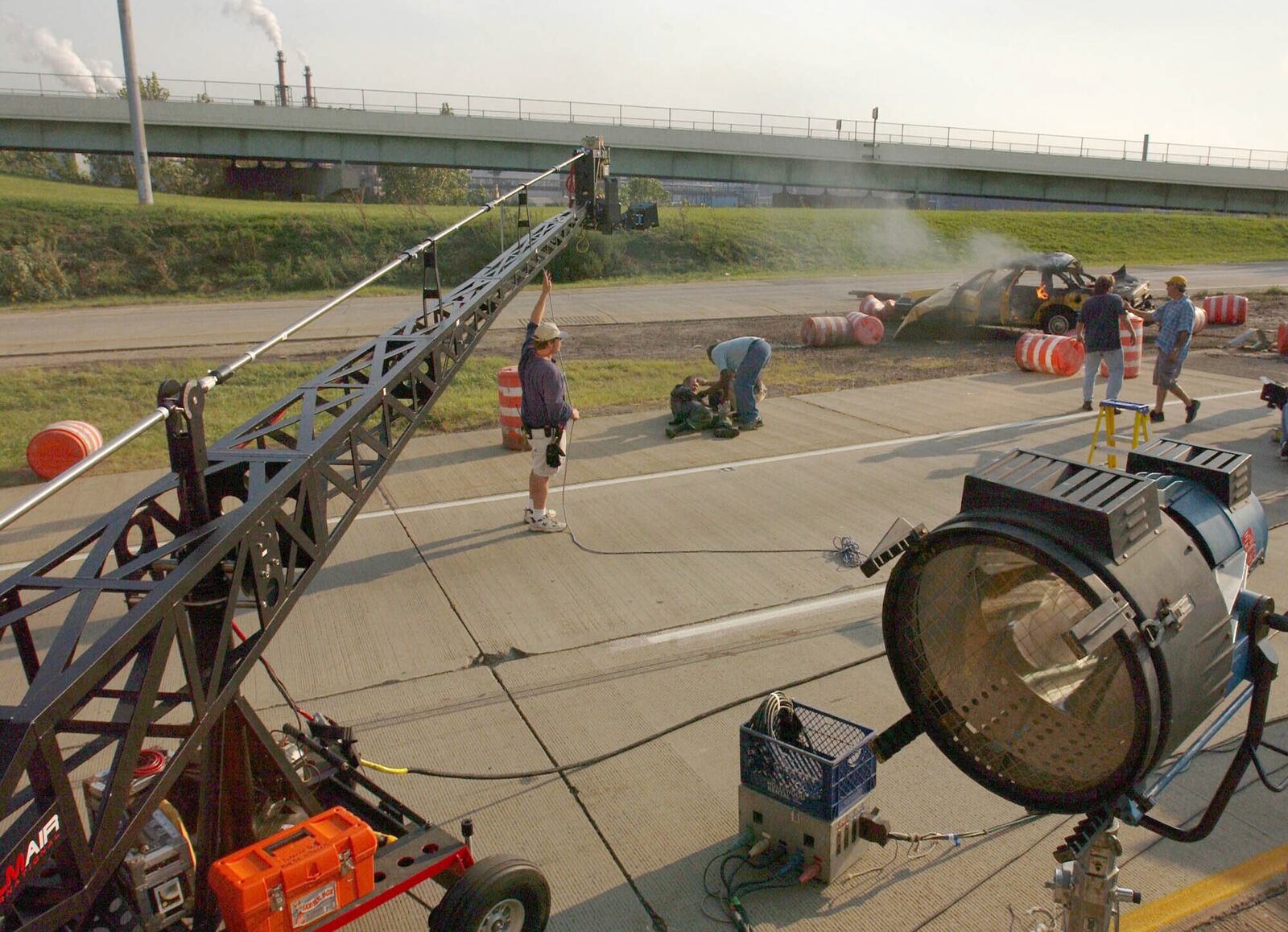 FILE - A film crew sets up a shot along Interstate 490 in Cleveland, Sept. 7, 2003, where the first day of shooting for a movie began with the closing a three mile section of the highway. (Marvin Fong/Cleveland.com via AP, File)