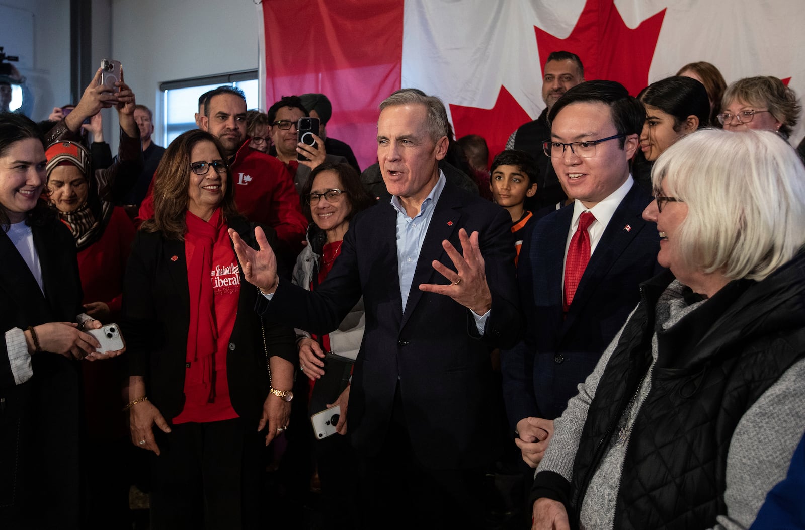 Mark Carney talks with supporters during his Liberal leadership campaign launch in Edmonton, on Thursday Jan. 16, 2025. (Jason Franson/The Canadian Press via AP)