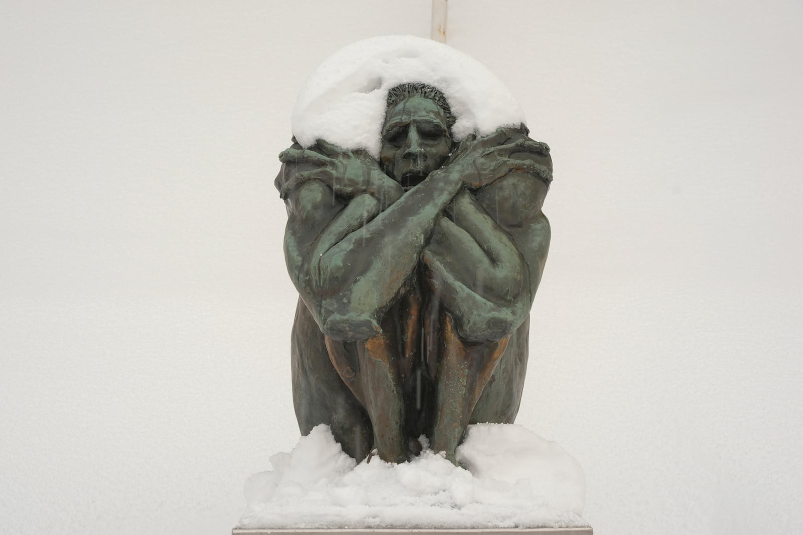 A sculpture is covered in snow on the steps of Erie Art Museum Tuesday, Nov. 5, 2024 in Erie, Pa. (AP Photo/Gene J. Puskar)