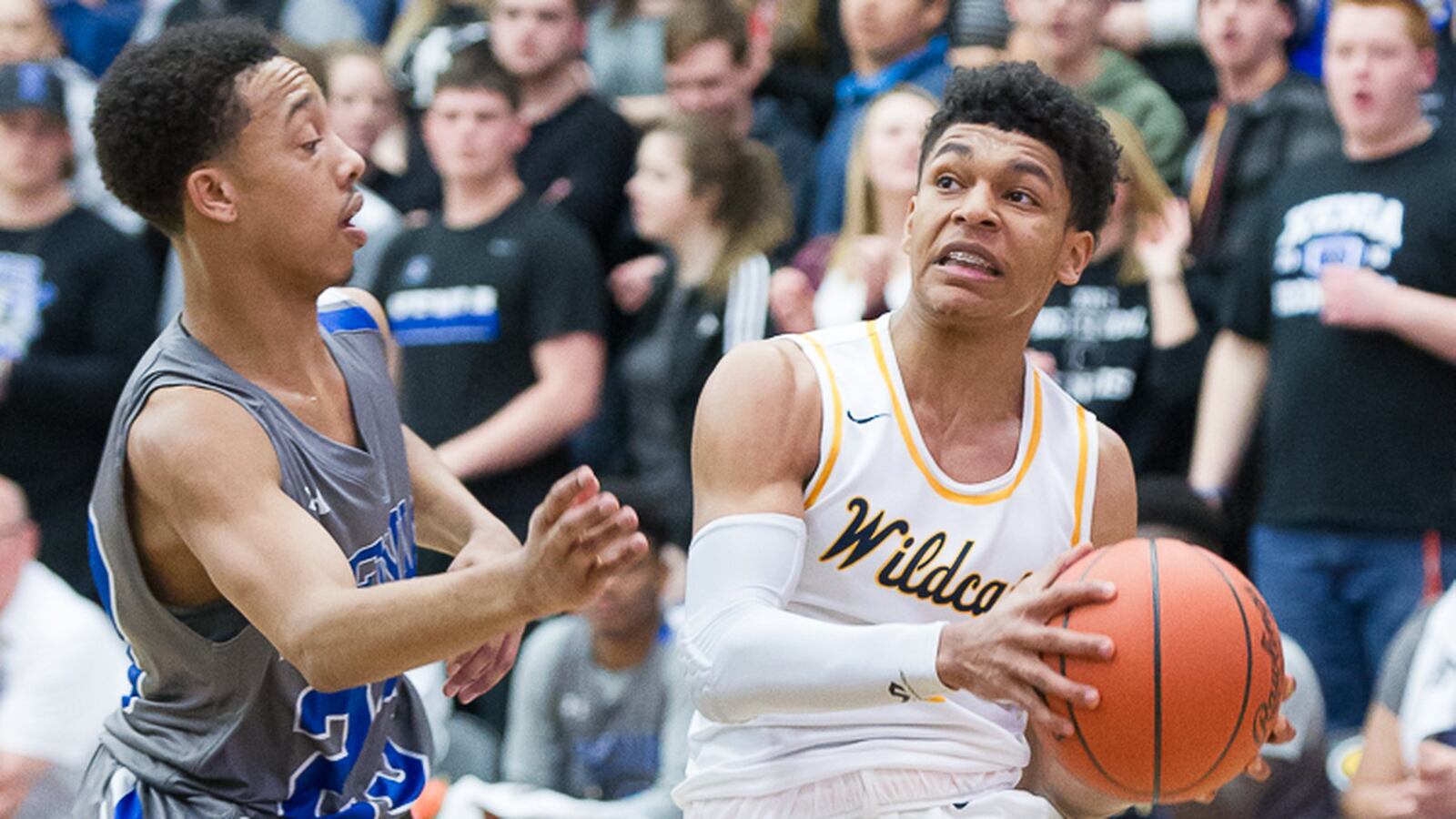 Springfield senior guard Michael McKay looks to pass while being guarded by Xenia’s Ricky Williams during a Division I sectional final at Centerville High School on Friday, March 3, 2017. Contributed Photo/Bryant Billing