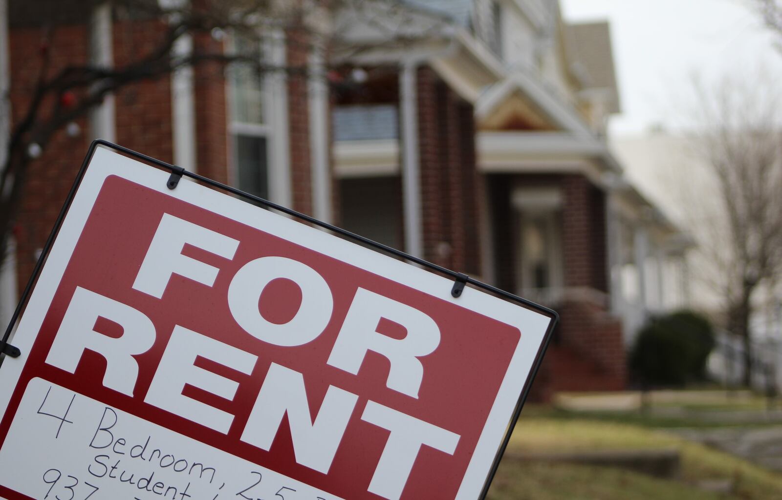 A For Rent sign posted outside a home in Dayton. CORNELIUS FROLIK / STAFF