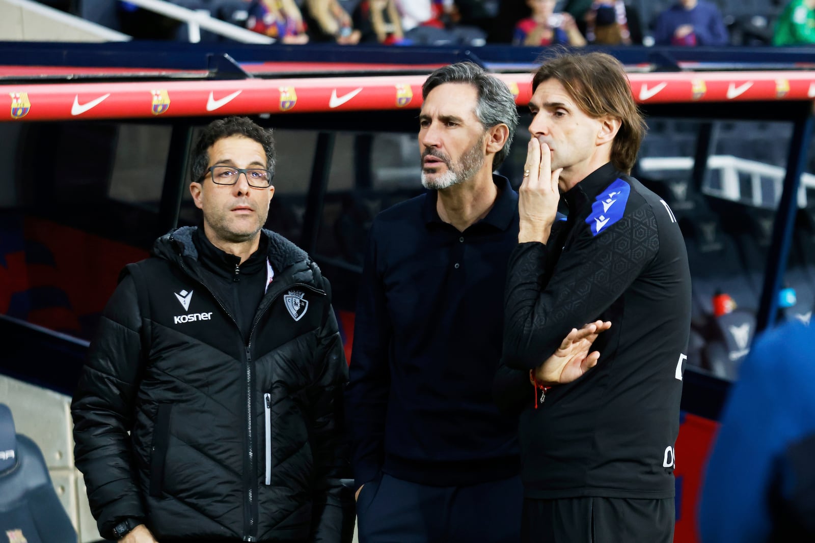 Osasuna's head coach Vicente Moreno, centre, looks on ahead of the Spanish La Liga soccer match between Barcelona and Osasuna at the Lluis Companys Olympic Stadium, in Barcelona, Spain, Saturday, March 8, 2025. (AP Photo/Joan Monfort)