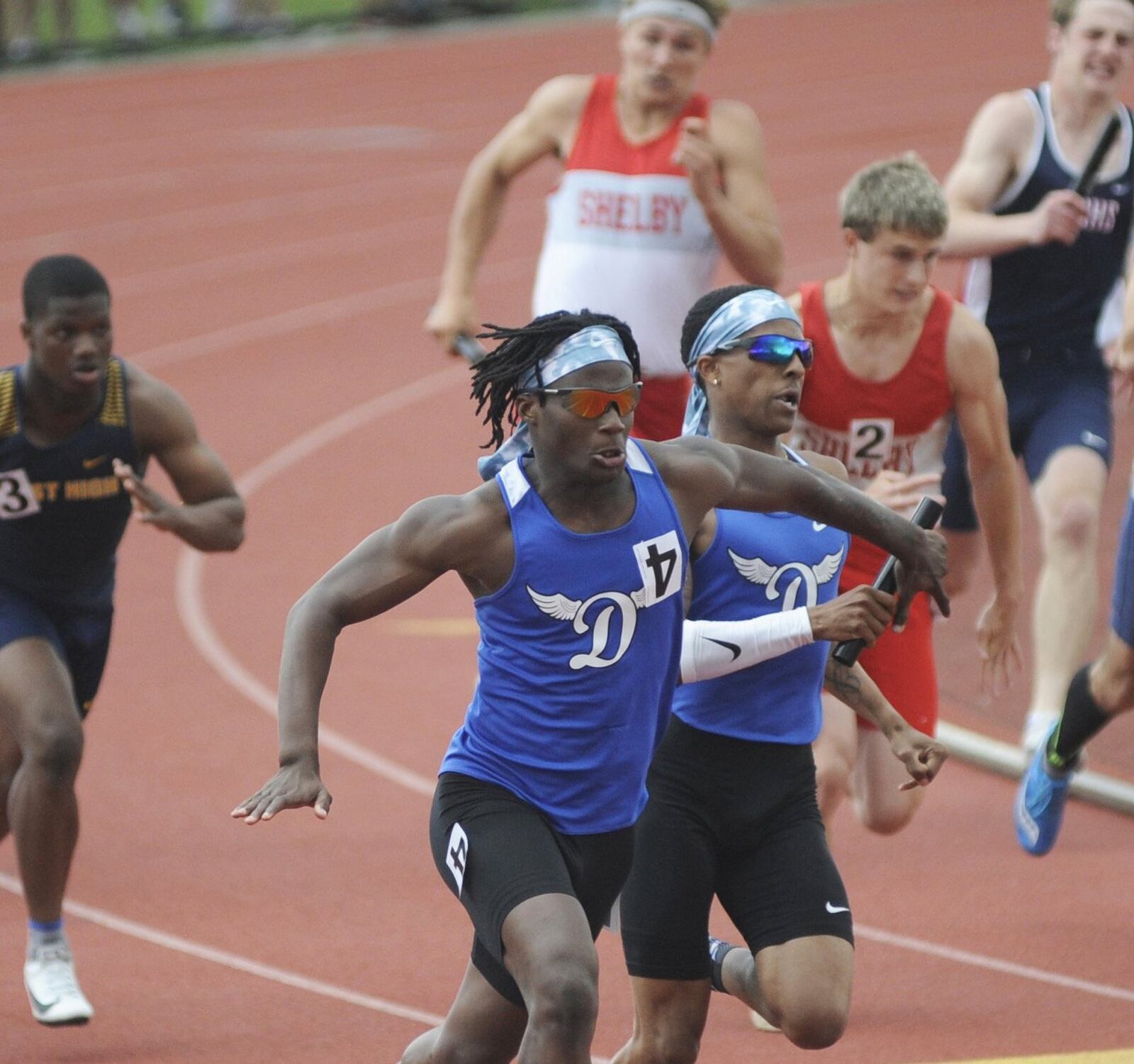 Dunbar’s Zamir Youngblood (right) hands off to 400 relay anchor Durron Harris during the D-II state track and field meet at OSU’s Jesse Owens Memorial Stadium in Columbus on Friday, May 31, 2019. MARC PENDLETON / STAFF